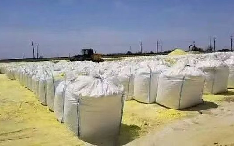 Sulphur stockyard panorama with forklift loading