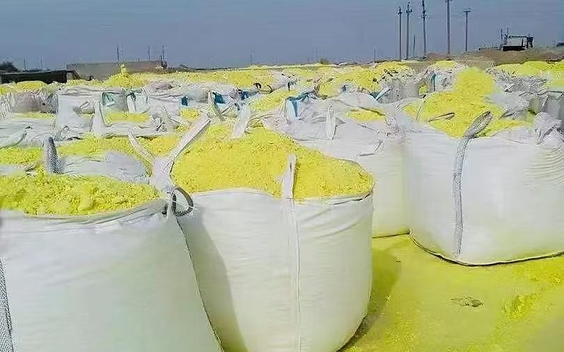 Sulphur bag stockpile under clear blue sky